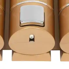 Alt text: Modern gold-colored dispenser bottles for skincare, lotion, or cosmetic products, designed for elegant and practical use in beauty clinics or salons.