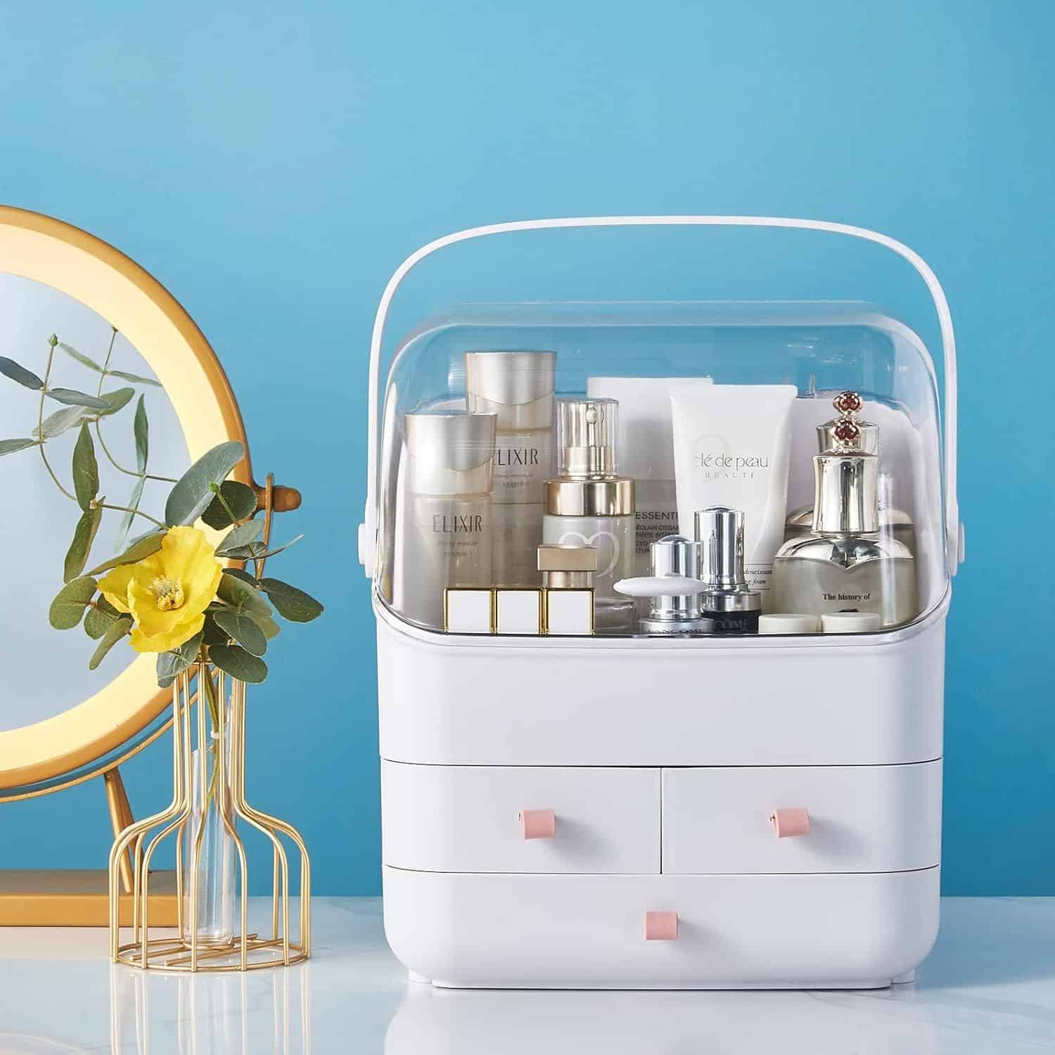 A modern, organized cosmetic storage box with skincare products on a tabletop, against a blue background, highlighting skincare essentials, beauty, and hygiene.