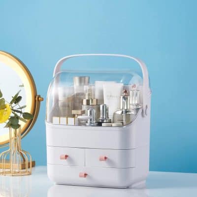 Versatile white vanity organizer with drawers and clear lid for storing skincare, beauty, and cosmetic items.