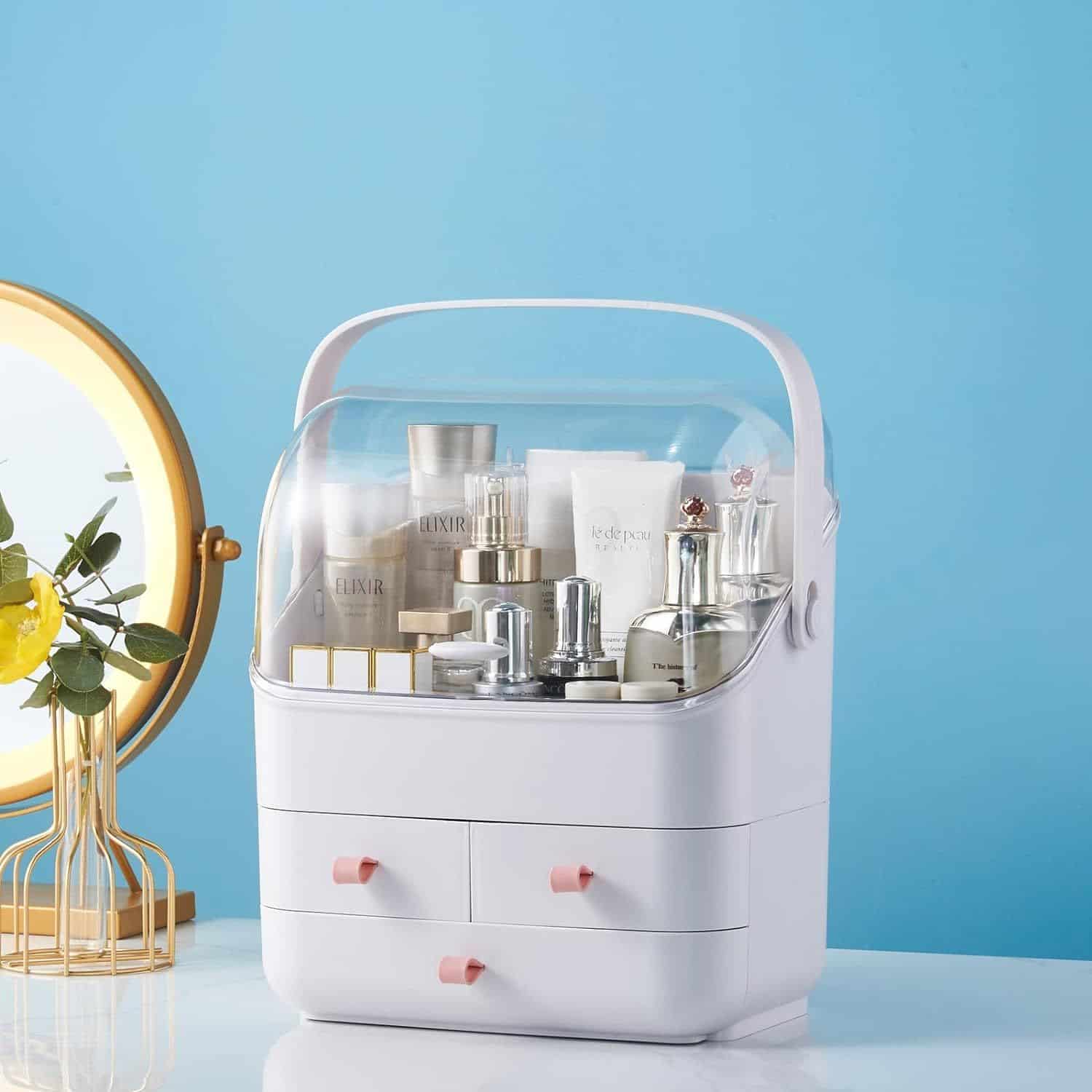 Versatile white vanity organizer with drawers and clear lid for storing skincare, beauty, and cosmetic items.