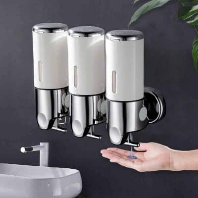 Wall-mounted soap or sanitizer dispenser, sleek white and chrome design for hygienic hand cleaning, ideal for optical clinics and medical settings.
