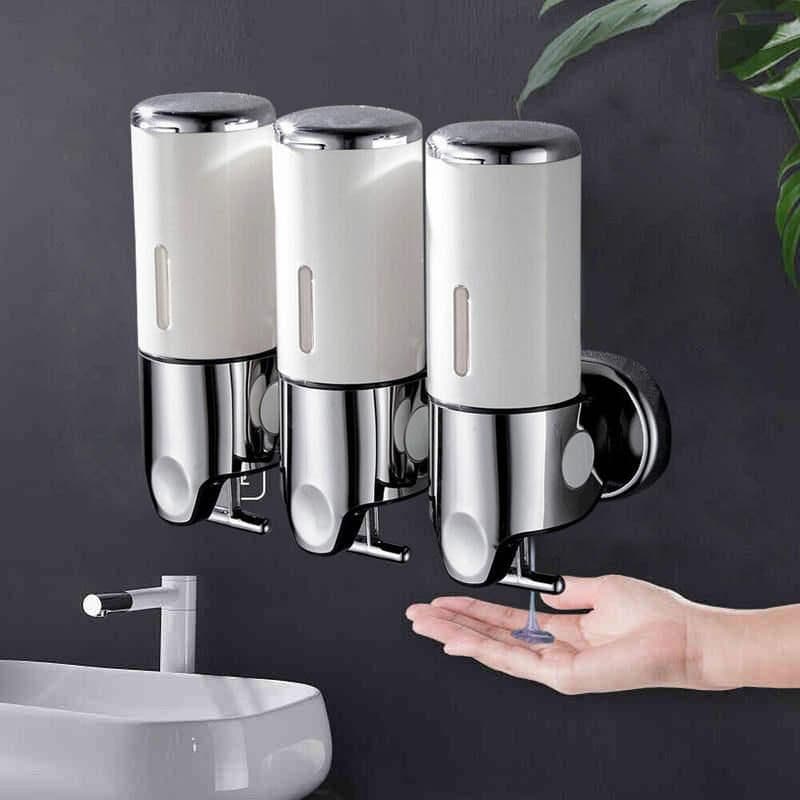 Wall-mounted soap or sanitizer dispenser, sleek white and chrome design for hygienic hand cleaning, ideal for optical clinics and medical settings.