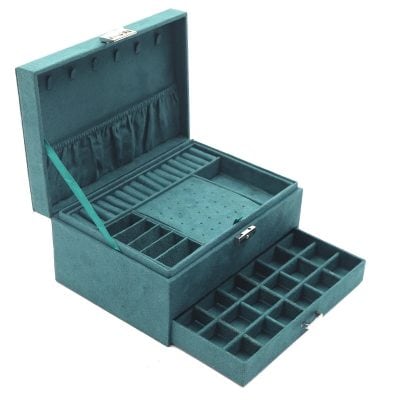Luxurious teal velvet jewelry organizer with multiple compartments and drawers for rings, necklaces, and bracelets, ideal for elegant display and safekeeping.