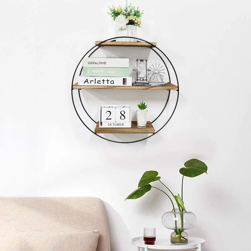 Decorative wall shelf with optical fashion books and a vintage hourglass in a stylish optometry setting.