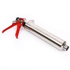 A professional-grade caulking gun with a stainless steel barrel and red handle, ideal for precise application of sealants and adhesives in construction and home improvement projects.