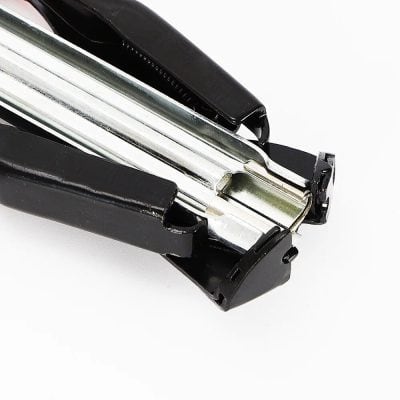 Office stapler, black and silver, used for paper organization, professional office stationery, durable and reliable binding tool, essential for workspaces.