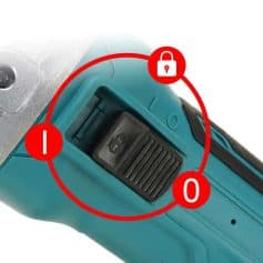 A close-up of a power tool's battery lock switch featuring a safety lock icon and on/off indicators, ensuring safe operation during use.