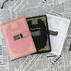 Stylish passport covers with secure lock, decorative gold accents, available in pink, black, and white, ideal for travelers seeking elegant and functional travel accessories.