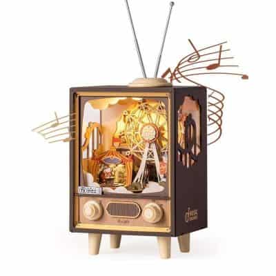 Handcrafted vintage musical box with moving parts and musical notes, perfect for music lovers and collectors seeking unique decorative items.