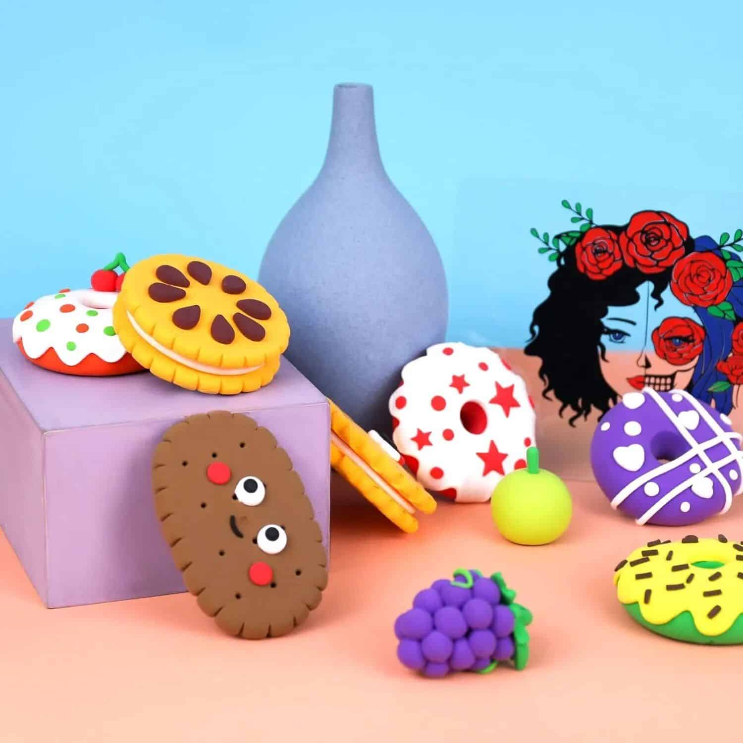 Delicate handcrafted clay cookies with playful designs, abstract art piece with roses, and elegant decorative items serve as creative eye-catching decor for opt.
