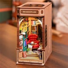 An intricate miniature bookshop decor featuring a cozy reading nook with a red armchair, surrounded by bookshelves filled with colorful books, creating a charming and inviting atmosphere for book lovers.