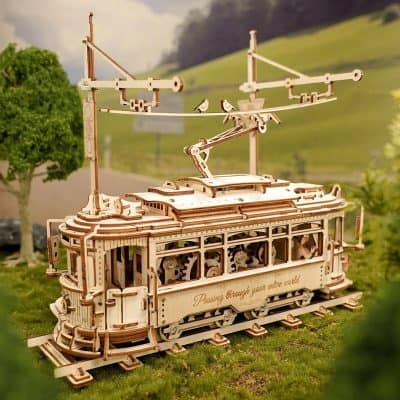 Detailed wooden model of a vintage tram, perfect for eye care collectors and enthusiasts. Showcases intricate craftsmanship, ideal for decorating optometry clinics or optical stores.