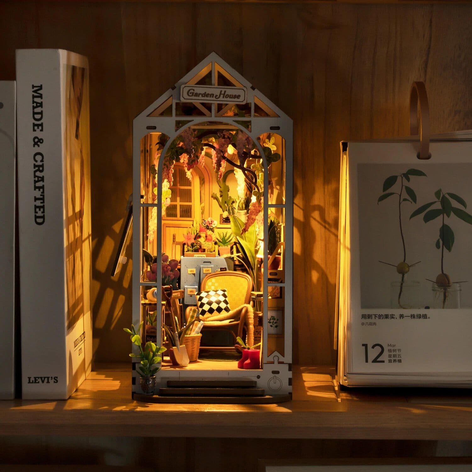 Adorable handcrafted garden house decor with miniature furniture, plants, and lighting, ideal for enhancing indoor spaces and promoting a calming, nature-inspired environment.