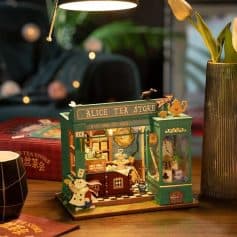 Decorative tea store model featuring detailed miniature tea sets, cozy ambiance, and charming design perfect for tea enthusiasts and collectors.