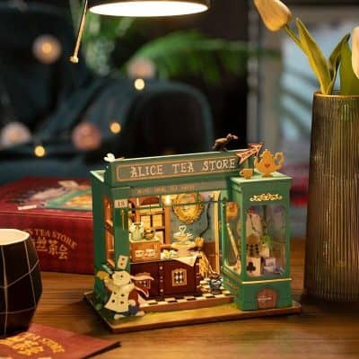 Decorative tea store model featuring detailed miniature tea sets, cozy ambiance, and charming design perfect for tea enthusiasts and collectors.