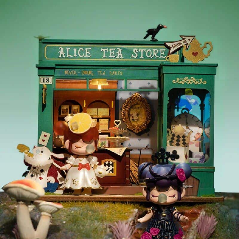 Colorful tea store miniature display with cute dolls and intricate details at Monalisa Medical.