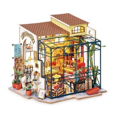 Detailed miniature flower shop with vibrant decor and tiny plants, perfect for home or office display, emphasizing flowers, gardening, and decorative craftsmanship.