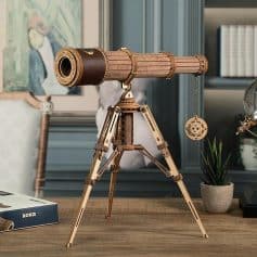 Detailed wooden telescope for stargazing and astronomy enthusiasts, perfect for educational and decorative purposes. Features precise craftsmanship for clear celestial viewing.