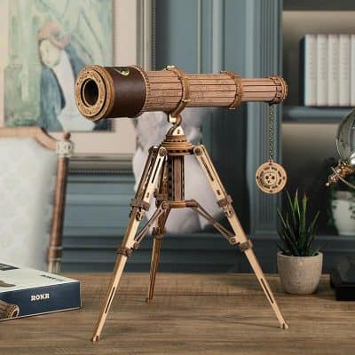 Detailed wooden telescope for stargazing and astronomy enthusiasts, perfect for educational and decorative purposes. Features precise craftsmanship for clear celestial viewing.