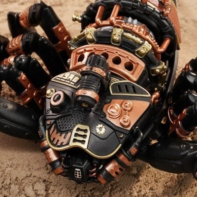 High-detail futuristic mechanical toy with black, bronze, and gold accents, showcasing complex gears and industrial elements, perfect for tech or sci-fi enthusiasts.