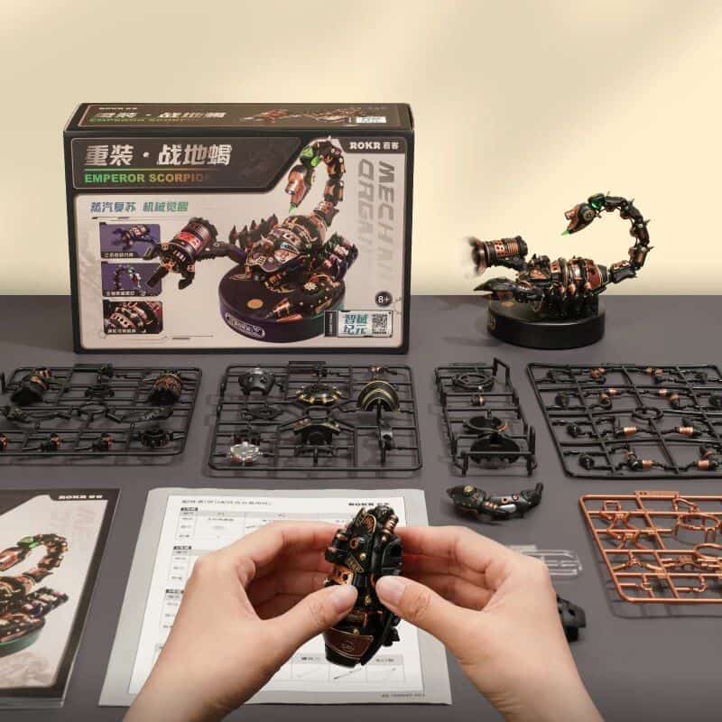 Detailed image of assembling a mechanical sci-fi model with parts, tools, and instruction sheets, from Monalisa Medical Store.