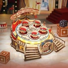 Colorful wooden tea cup amusement ride for children, perfect for parties and events, with detailed craftsmanship and playful design.