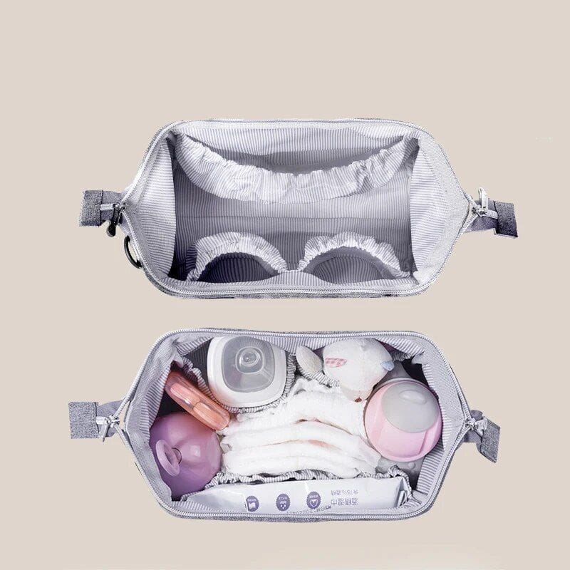 Organize baby essentials with this portable diaper bag from Monalisa Store, featuring multiple compartments for diapers, bottles, wipes, and toys for convenient travel.