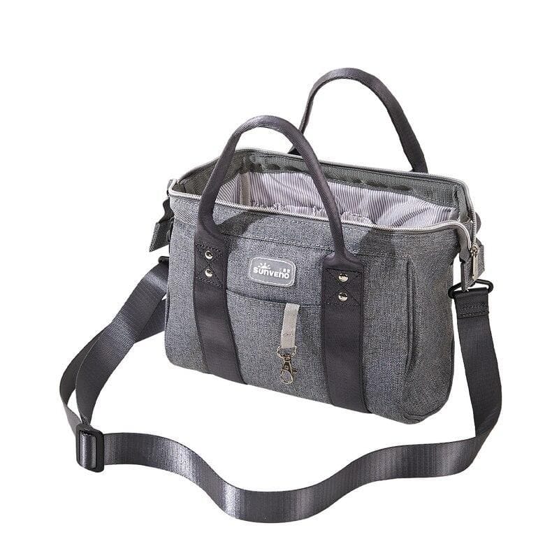 Durable gray storage bag for optical accessories, luggage, and personal items, featuring multiple compartments, handles, and adjustable shoulder strap for convenience.
