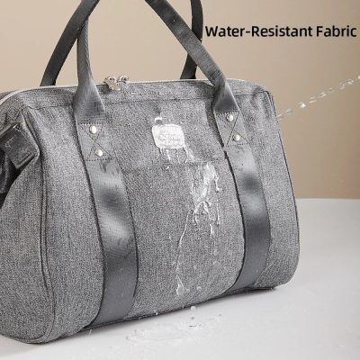 Dark gray water-resistant fabric travel bag with sturdy black handles and secure zipper closure. Designed for durability and functional style for everyday and travel needs.