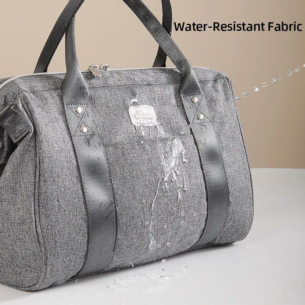 Dark gray water-resistant fabric travel bag with sturdy black handles and secure zipper closure. Designed for durability and functional style for everyday and travel needs.