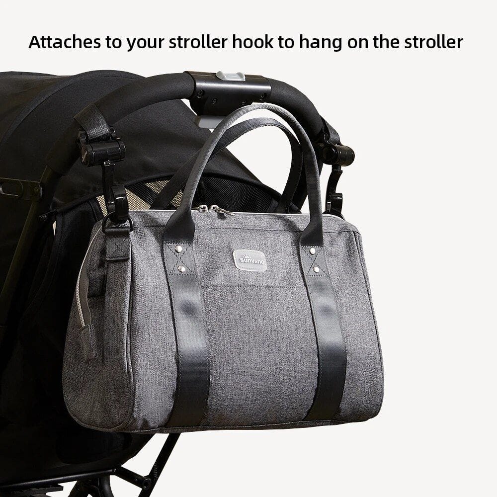 Durable gray stroller organizer bag with carrying handles, attaches securely to stroller hook, ideal for storing baby's essentials and accessories during outings.