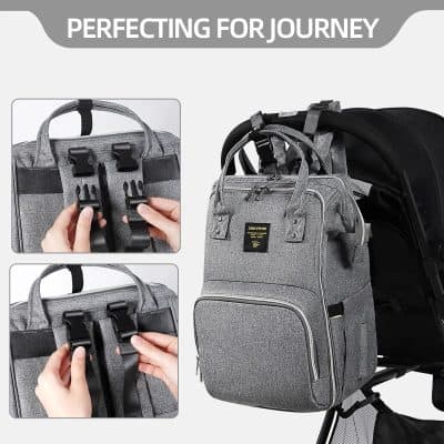 High-quality gray diaper bag with multiple compartments and secure clips for parents on the go. Perfect for carrying baby essentials in style.