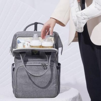 Elegant grey carry-all diaper bag with insulated bottle pockets. Perfect for moms on the go, combining functionality and style for your baby's needs.