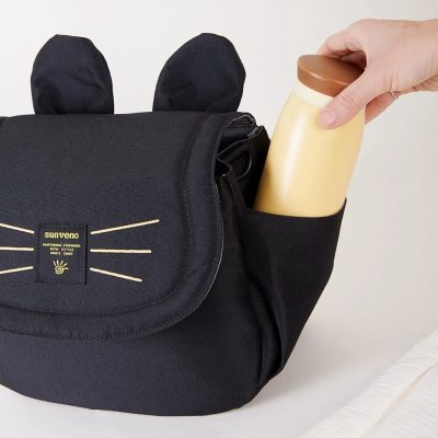 Black diaper bag with insulated side pocket for bottles.
