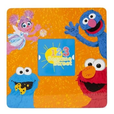 Colorful Sesame Street character plush toys for children.