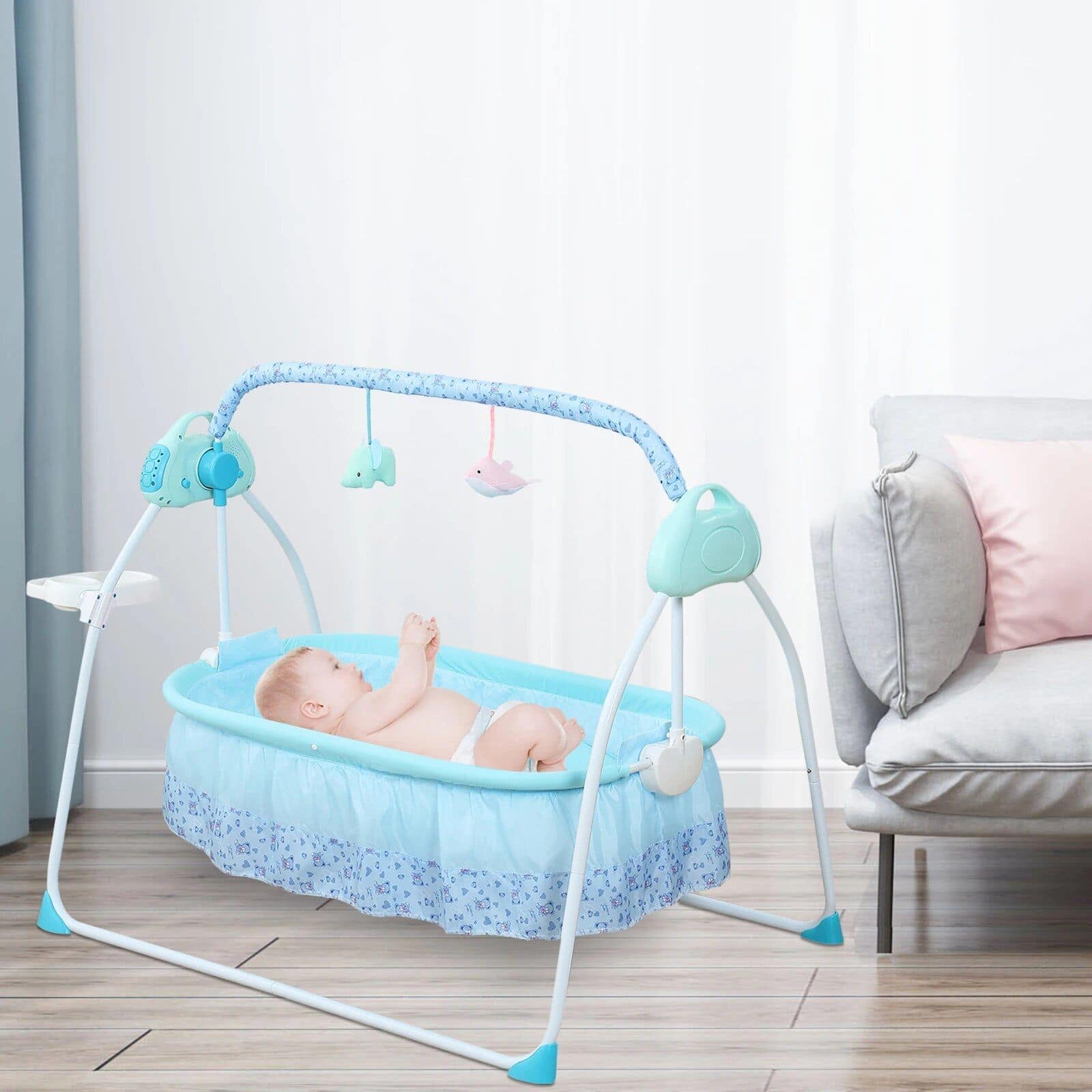Baby crib with mobile featuring plush hanging toys, comfortable bedding, and a soft pastel color scheme. Designed for infant comfort and entertainment, suitable for nurseries and baby care spaces. Provides a safe and nurturing environment for newborns.