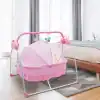Light pink baby cradle with canopy, musical mobile, and adjustable frame for infant comfort and safety. Perfect for newborns, stylish, and easy to assemble.