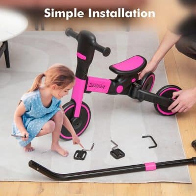 A pink and black children's balance bike with easy assembly shown, ideal for kids’ outdoor activities and learning to ride; perfect for promoting active lifestyles and outdoor fun.