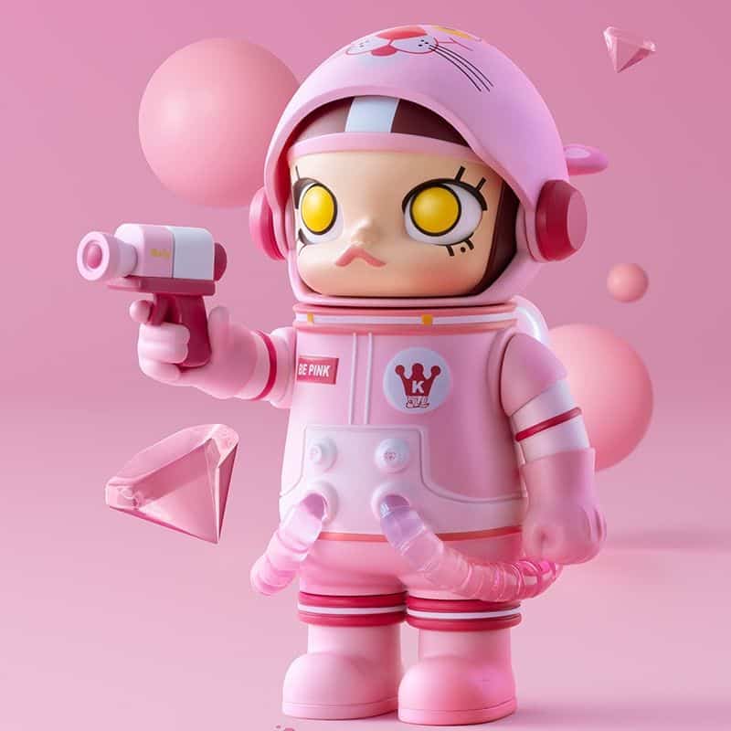 Adorable pink toy figurine wearing a helmet and holding a small gun, set against a pink background with floating geometric shapes. Perfect for children's toys, collectibles, and adorable character collectibles.