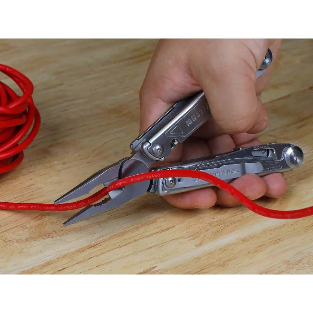 High-quality multi-tool pliers shown holding a red insulated optical fiber cable, featuring precision cutting blades and multiple functions for electrical and fiber optic work, perfect for optical fiber technicians.