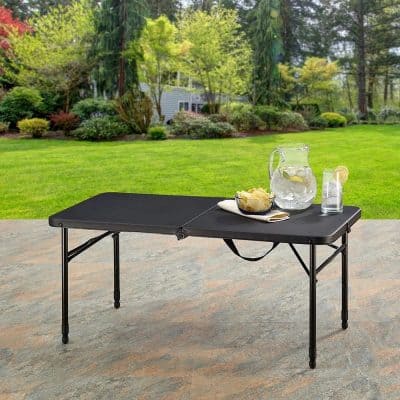 Quick-drying portable outdoor table ideal for garden, patio, or backyard gatherings with a durable black surface and lightweight foldable design.