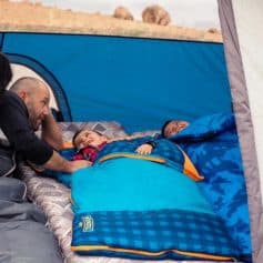 Comfortable outdoor sleeping bag for camping and adventures, ideal for family trips, providing warmth and relaxation in tent environments.