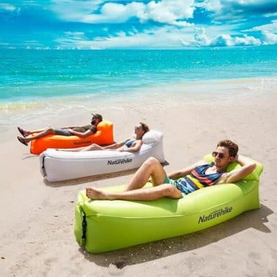 Inflatable beach loungers in vibrant colors, ideal for outdoor relaxation, seaside trips, and poolside lounging. Perfect for summer vacations, camping, or backyard fun, offering comfort and portability.