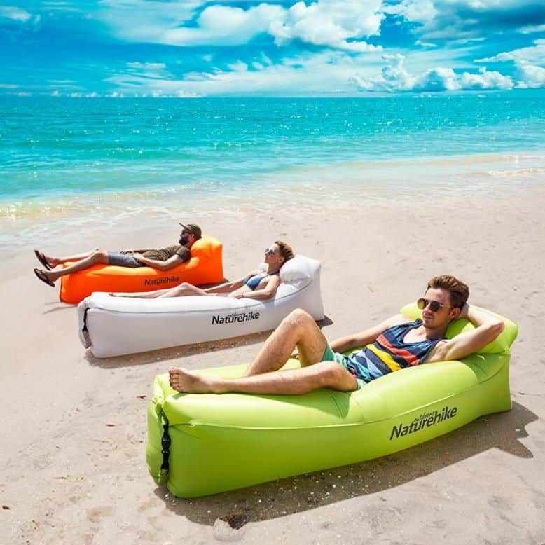 Inflatable beach loungers in vibrant colors, ideal for outdoor relaxation, seaside trips, and poolside lounging. Perfect for summer vacations, camping, or backyard fun, offering comfort and portability.