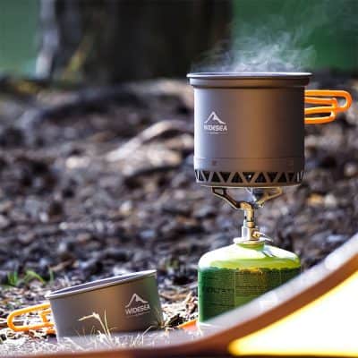 High-quality portable camping stove with gas canister, ideal for outdoor cooking, hiking, and backpacking adventures. Compact, lightweight, and easy to use for camping enthusiasts and outdoor explorers.