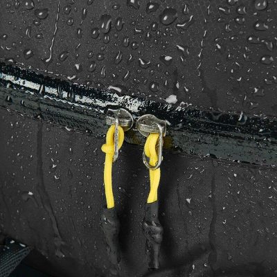 Rain-resistant storage with waterproof zippers and yellow cords, ideal for outdoor activities and protecting essentials from water damage.