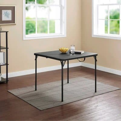 Versatile black office desk with sleek metal legs, perfect for workspace or study areas, offering stylish and functional furniture solutions for home or professional environments.
