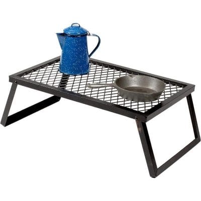 Stylish black tea pot stand with a metal grid surface, ideal for kitchen or tea ceremonies, ensuring heat resistance and durability for daily use.