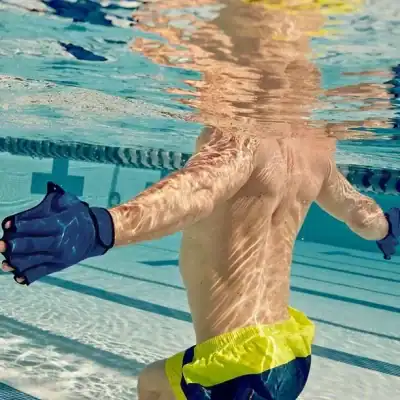 A male swimmer practicing in a swimming pool, highlighting aquatic fitness and sports. Focus on water sports, swimming exercise, and athletic training at Monalisa Medical store.