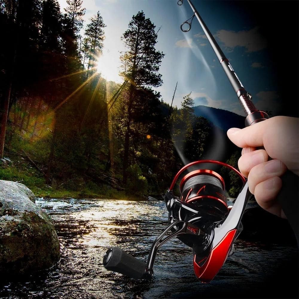 High-quality fishing reel displayed outdoors near a river with scenic nature, perfect for fishing enthusiasts.